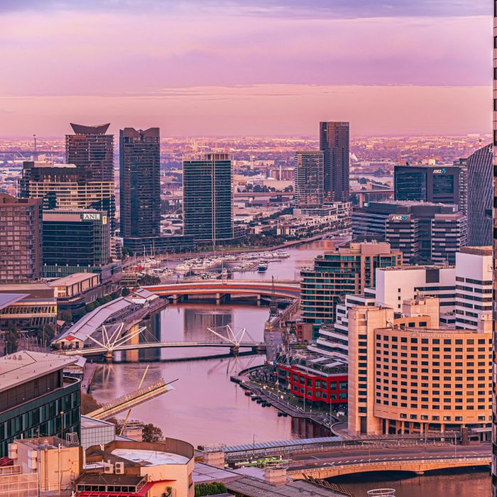 A breathtaking aerial view of Melbourne’s cityscape during twilight, capturing iconic landmarks.