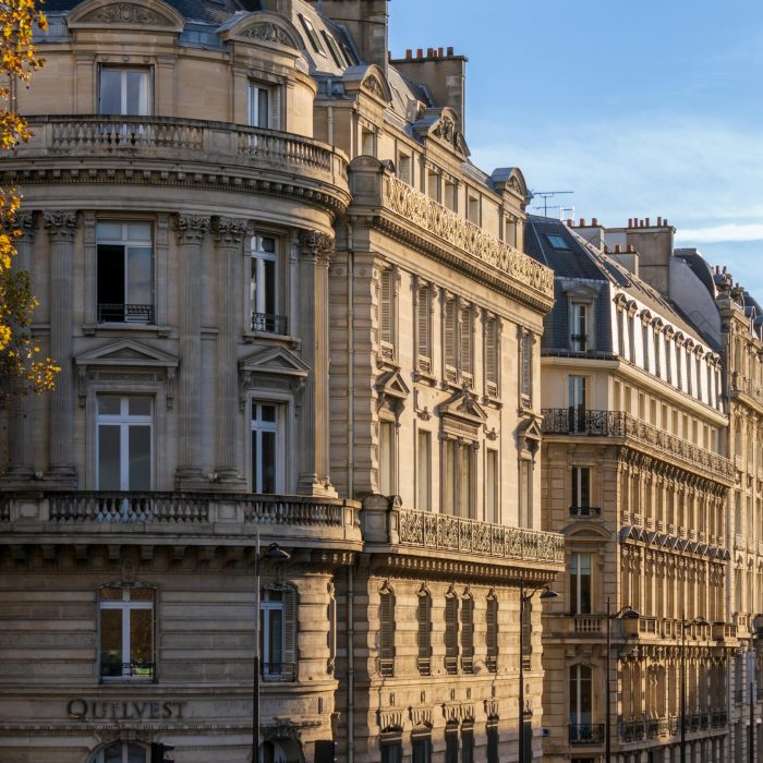 Elegant historic buildings on Boulevard Saint-Germain in Paris during daylight.