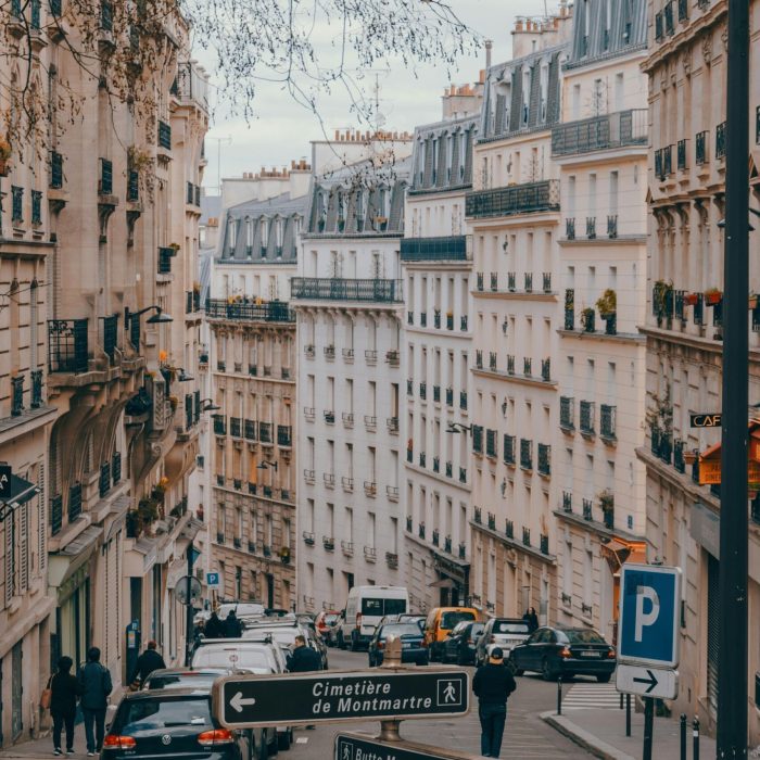 Explore the bustling streets of Montmartre, Paris with classic architecture and daily urban life.
